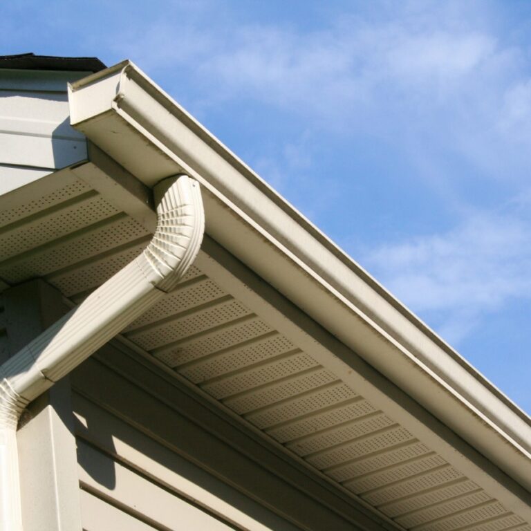 A view from below of a completed gutter and draining project on a residential home by The Exterior Company.