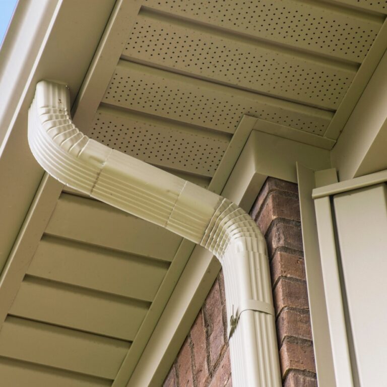 View up from the ground of a new gutter installed by The Exterior Company on a hanging roof.