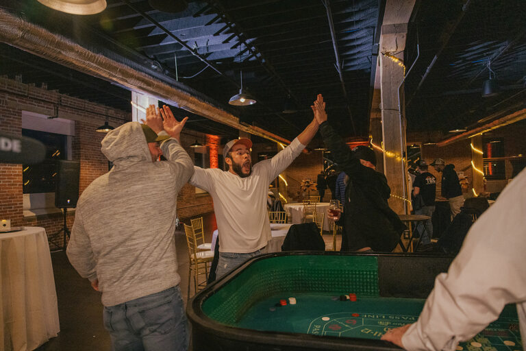 group of TEC employees celebrating a big win