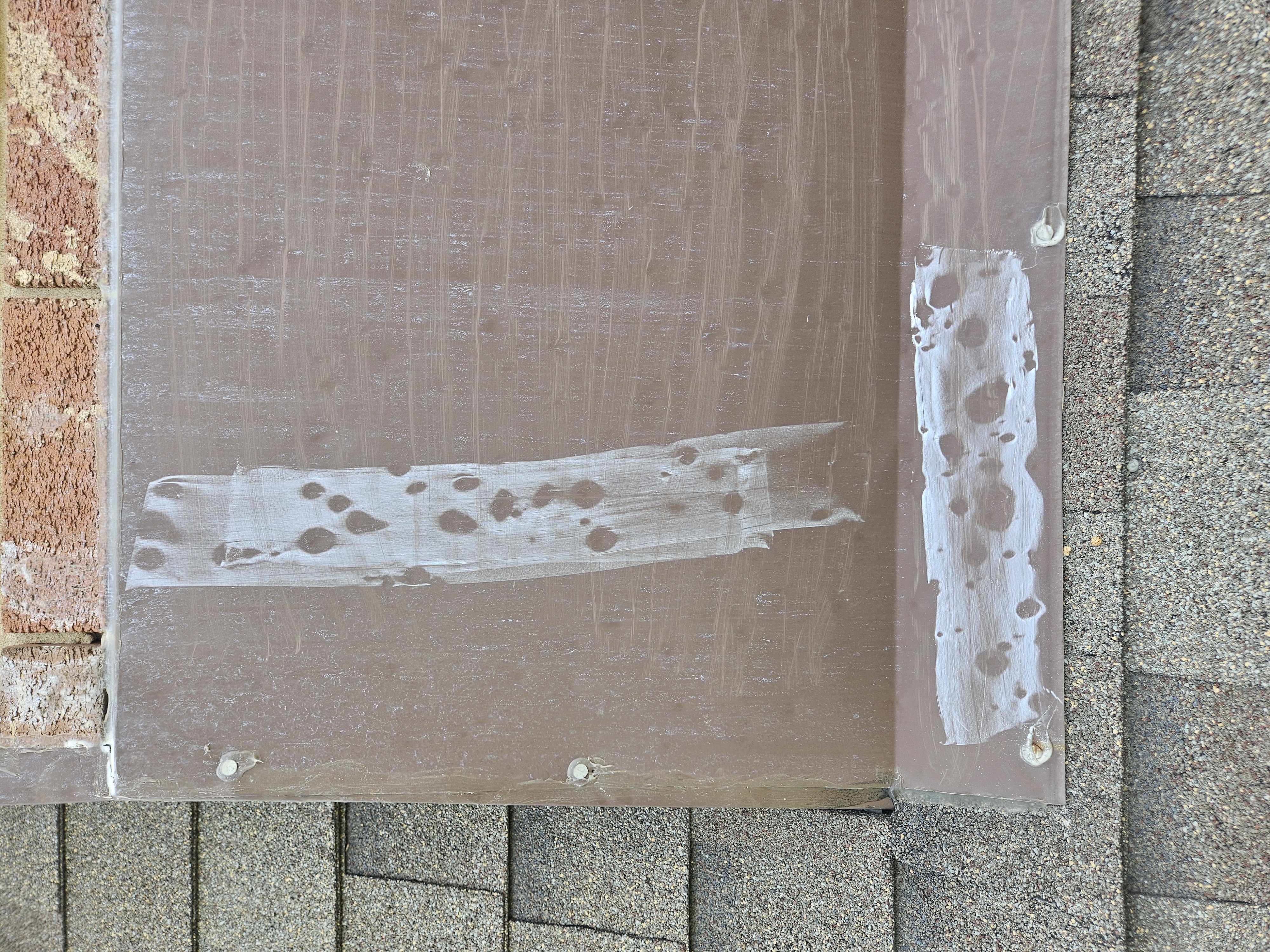 Hail impact marks documented on step flashing