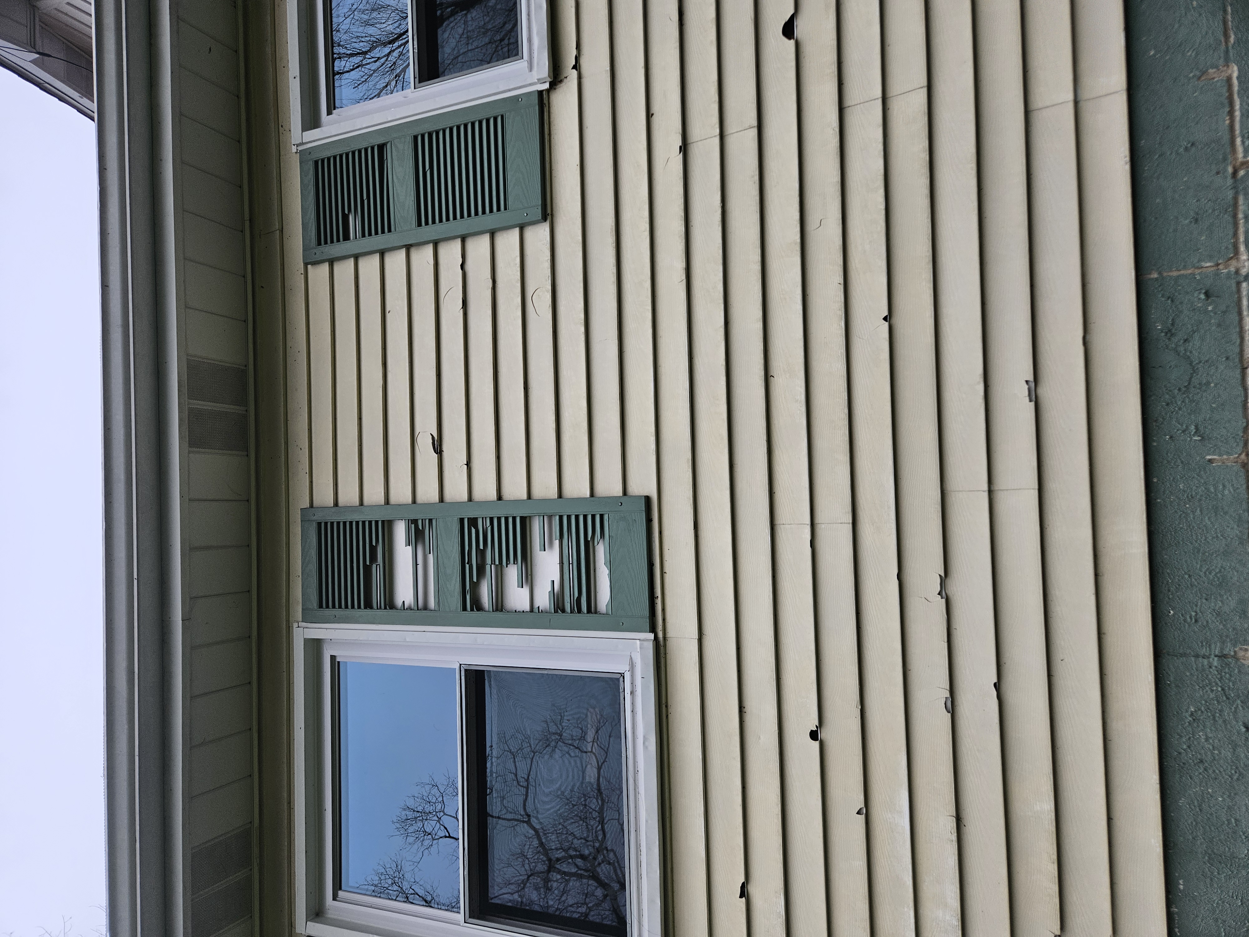 Hail damage to vinyl siding and shutters in Venango County