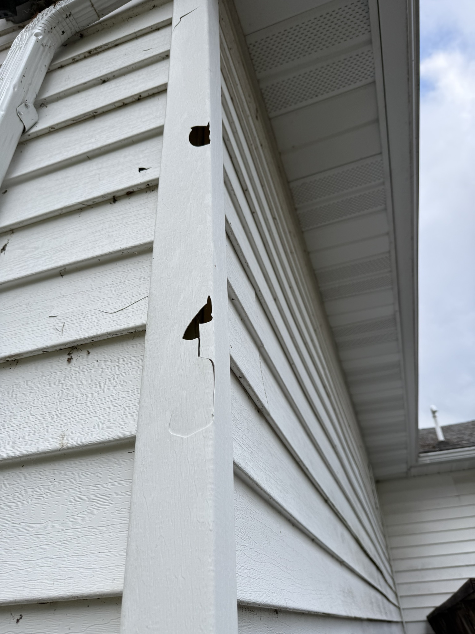 Hail damage punch-through holes in vinyl corner post