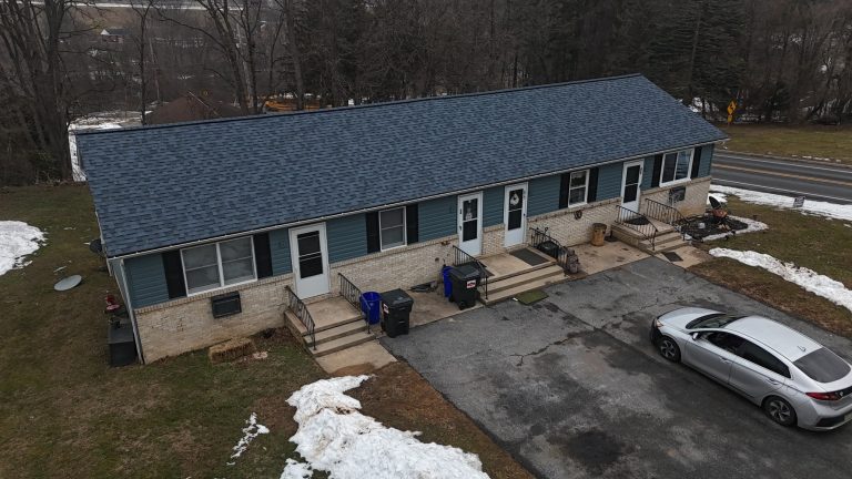 Residential multi-unit property featuring a professionally installed asphalt shingle roof and exterior construction