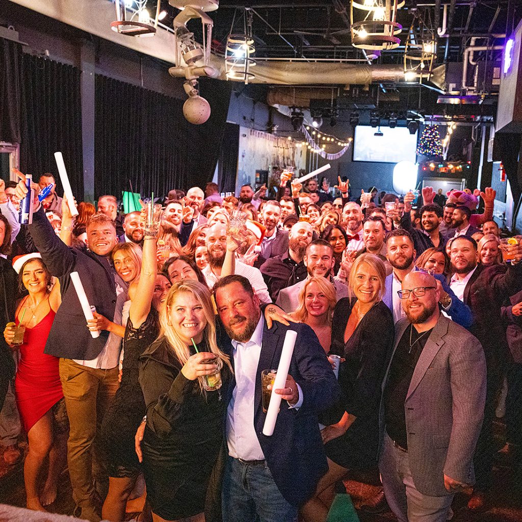 A group photo of TEC employees at an annual Christmas party