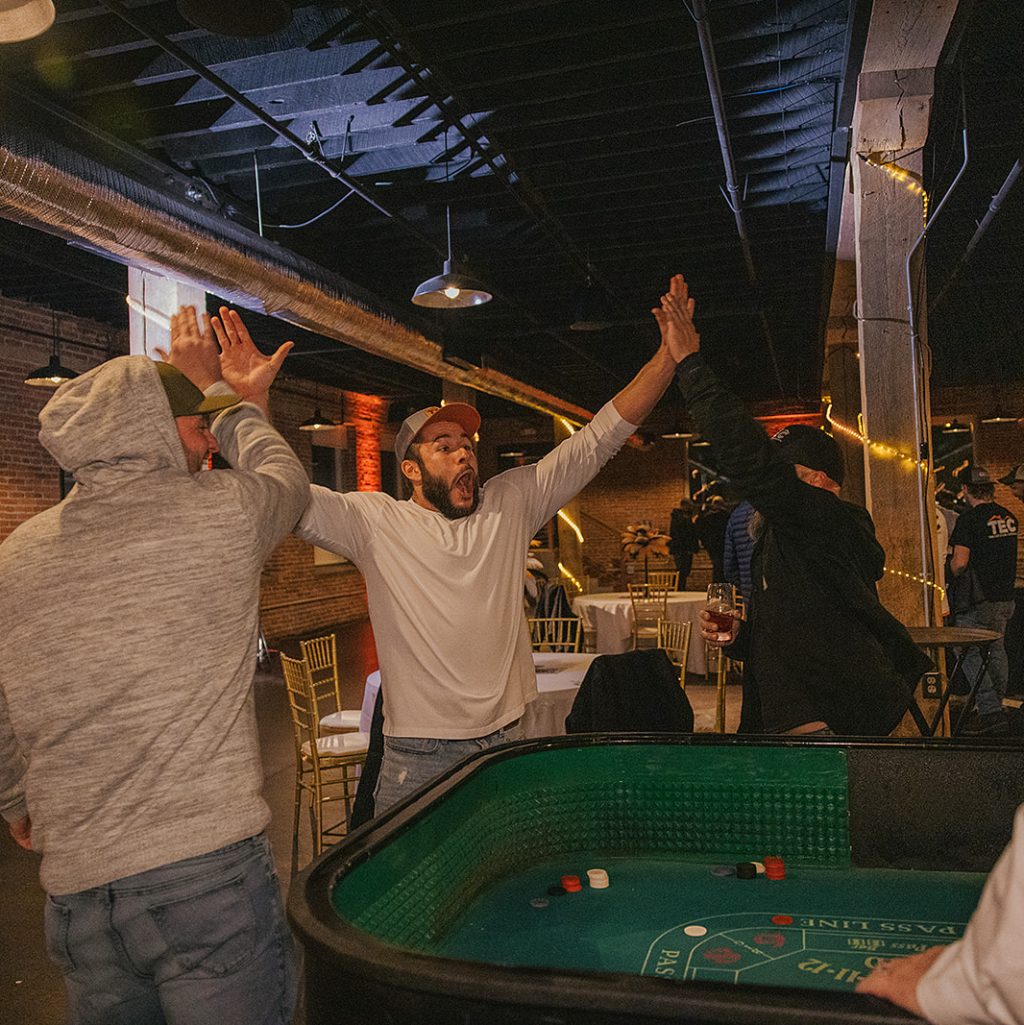 group of TEC employees celebrating a big win